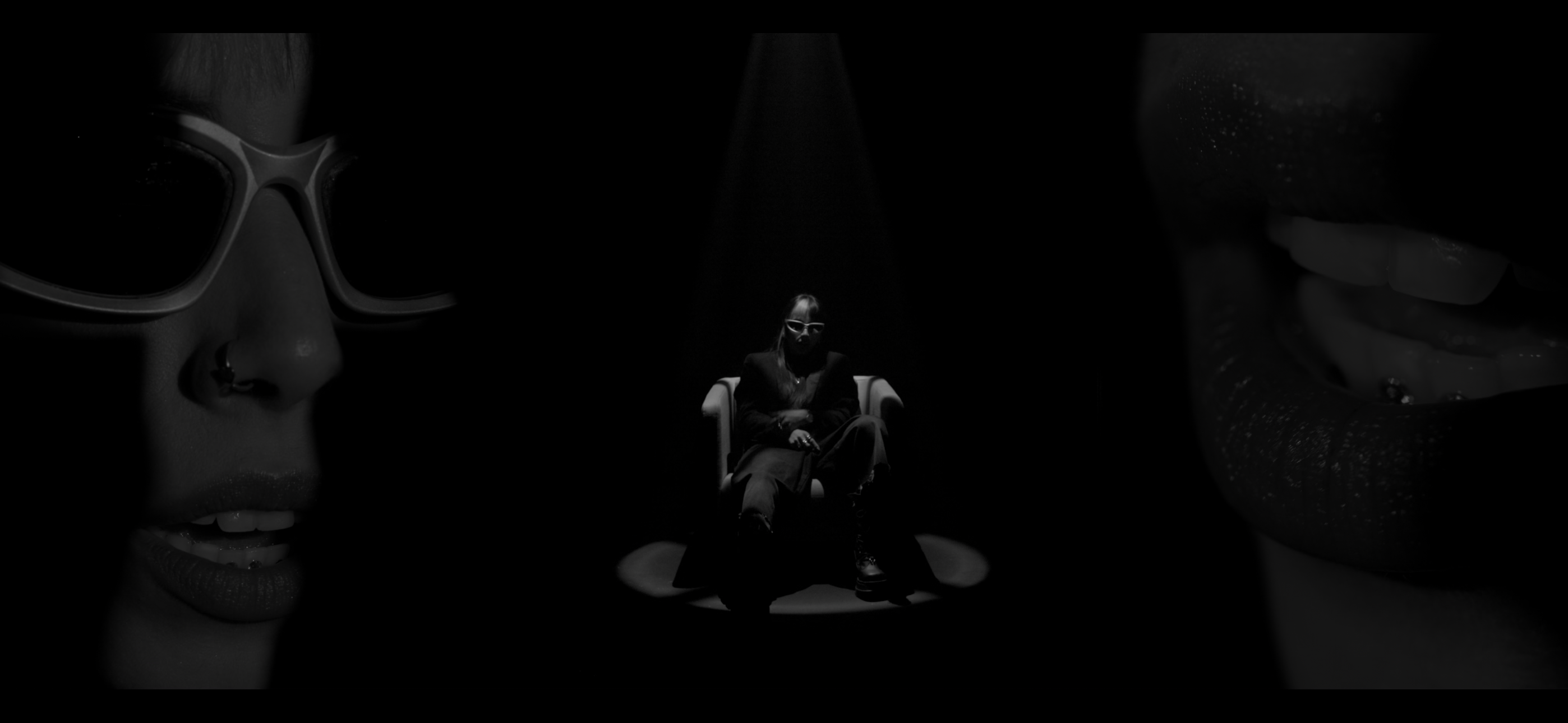 Black-and-white composition of a seated performer and face close-ups